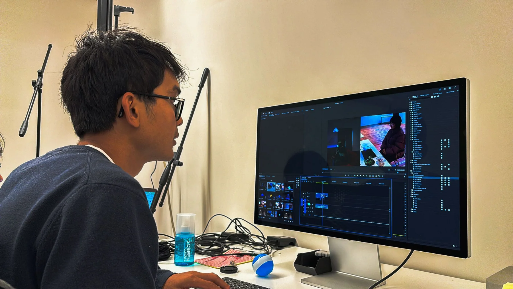 A teammate editing the video in Premiere Pro